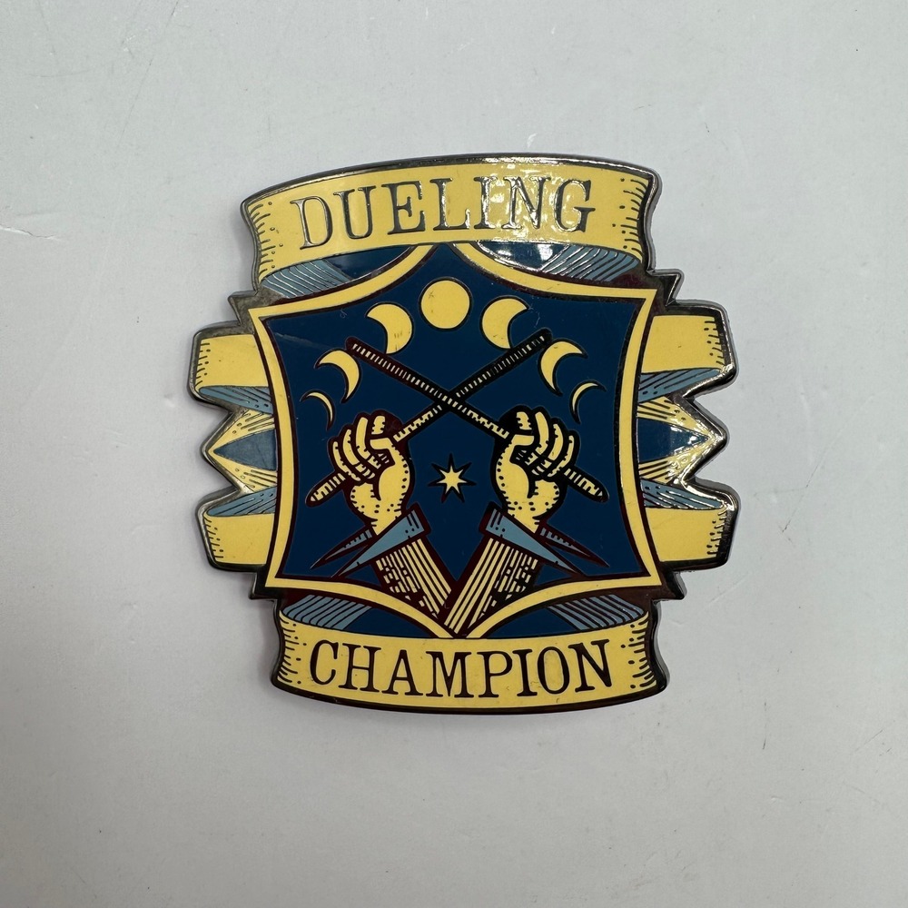 The Wizarding Trunk Dueling Champion Pin Blue Yellow Magic Wand Enamel